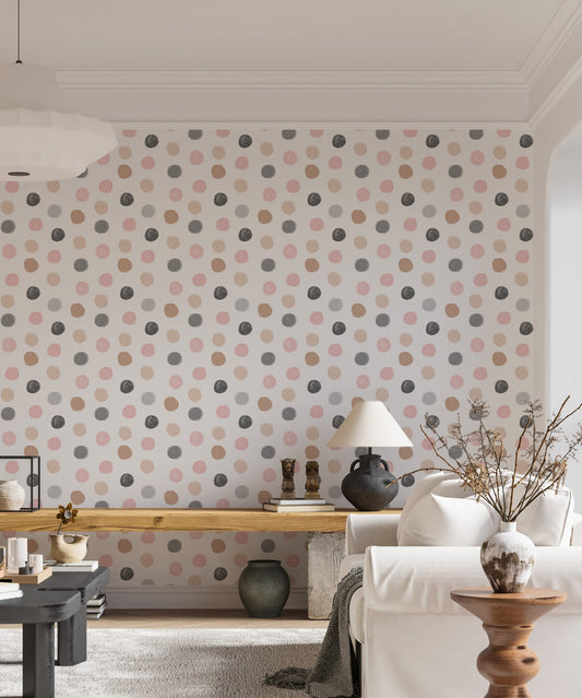 Hand drawn grey and pink dots wallpaper behind a wooden table