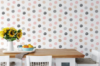 Pastel circle pattern wallpaper in a bright dining area with sunflowers