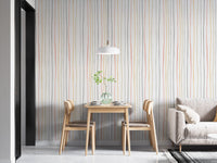 Pastel striped wallpaper behind a small wooden dining table.