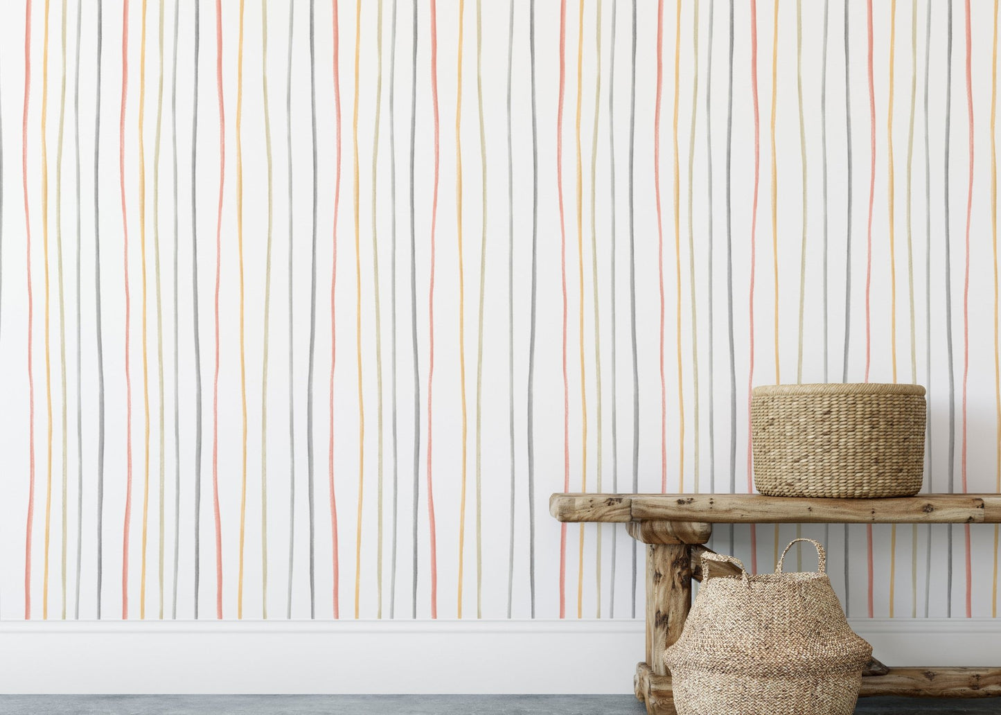 Pastel striped wallpaper behind a wooden bench and floor baskets