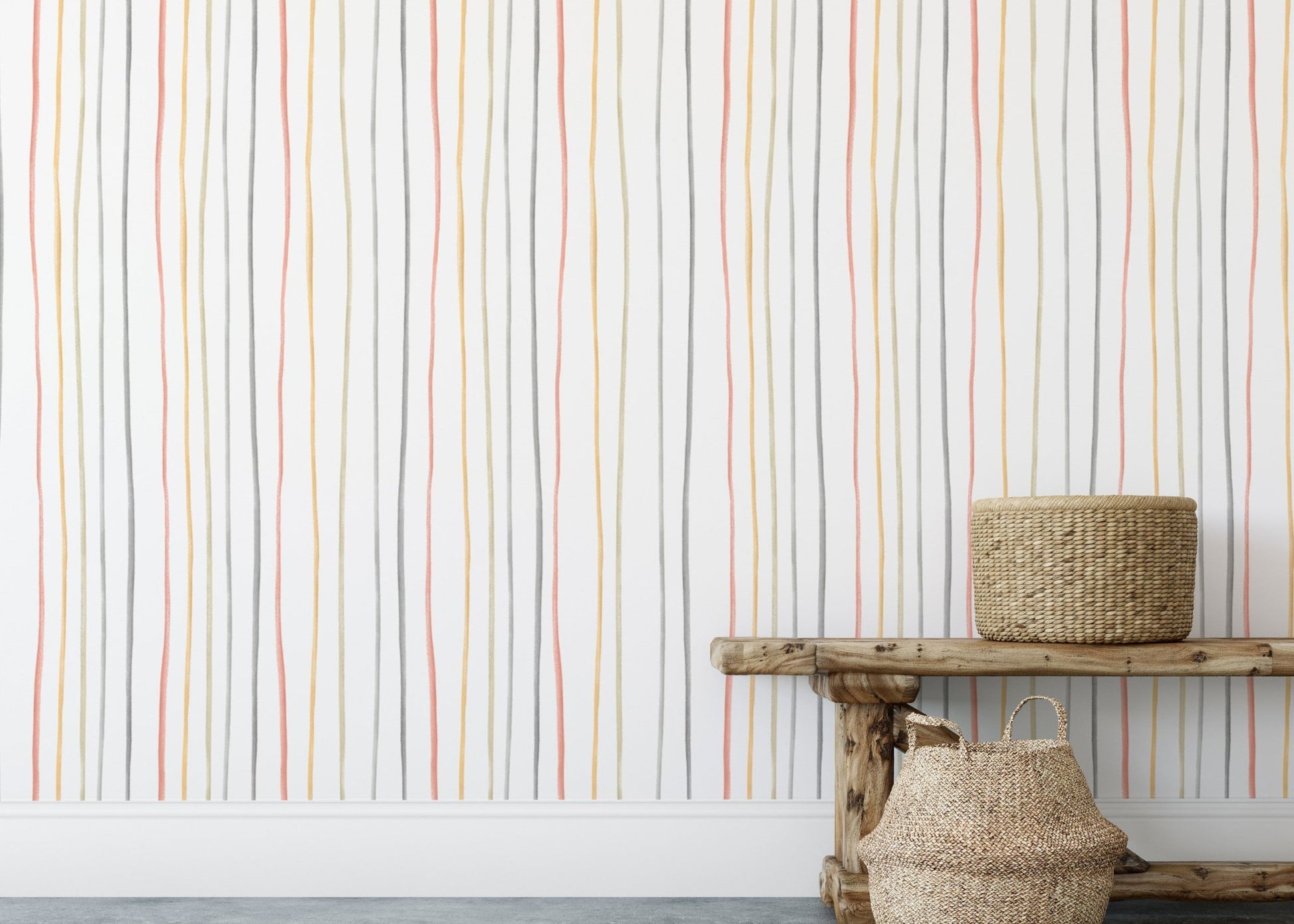 Pastel striped wallpaper behind a wooden bench and floor baskets