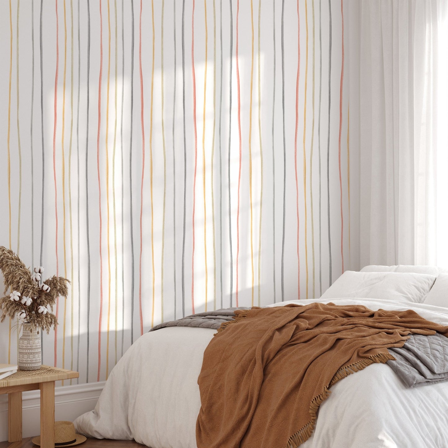 Pastel linear wallpaper in a bedroom with brown and white bedding
