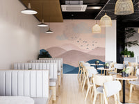 Soft mountain wall mural in elegant pastel colors in cafe area.
