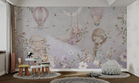 Girls and bunnies with hot air balloons on purple floral wall mural in study area