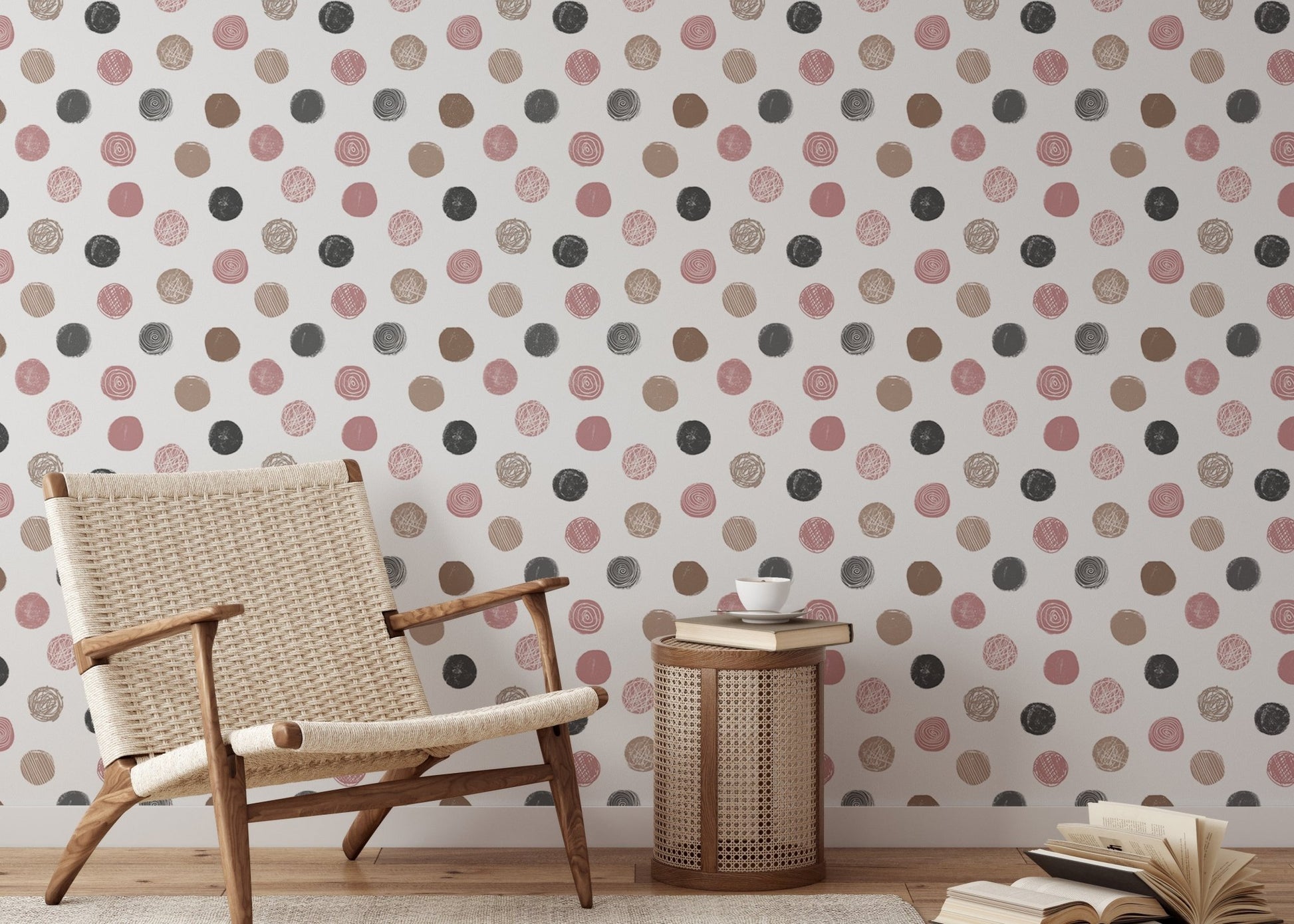 Neutral nursery featuring a polka dot wallpaper and light wood furniture.