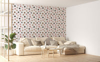 Scandinavian style chair next to a pastel polka dot wallpaper for feature walls