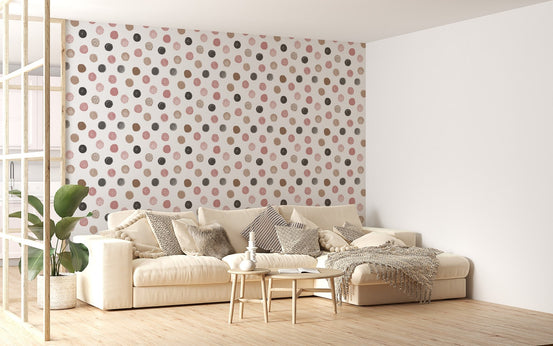 Scandinavian style chair next to a pastel polka dot wallpaper for feature walls