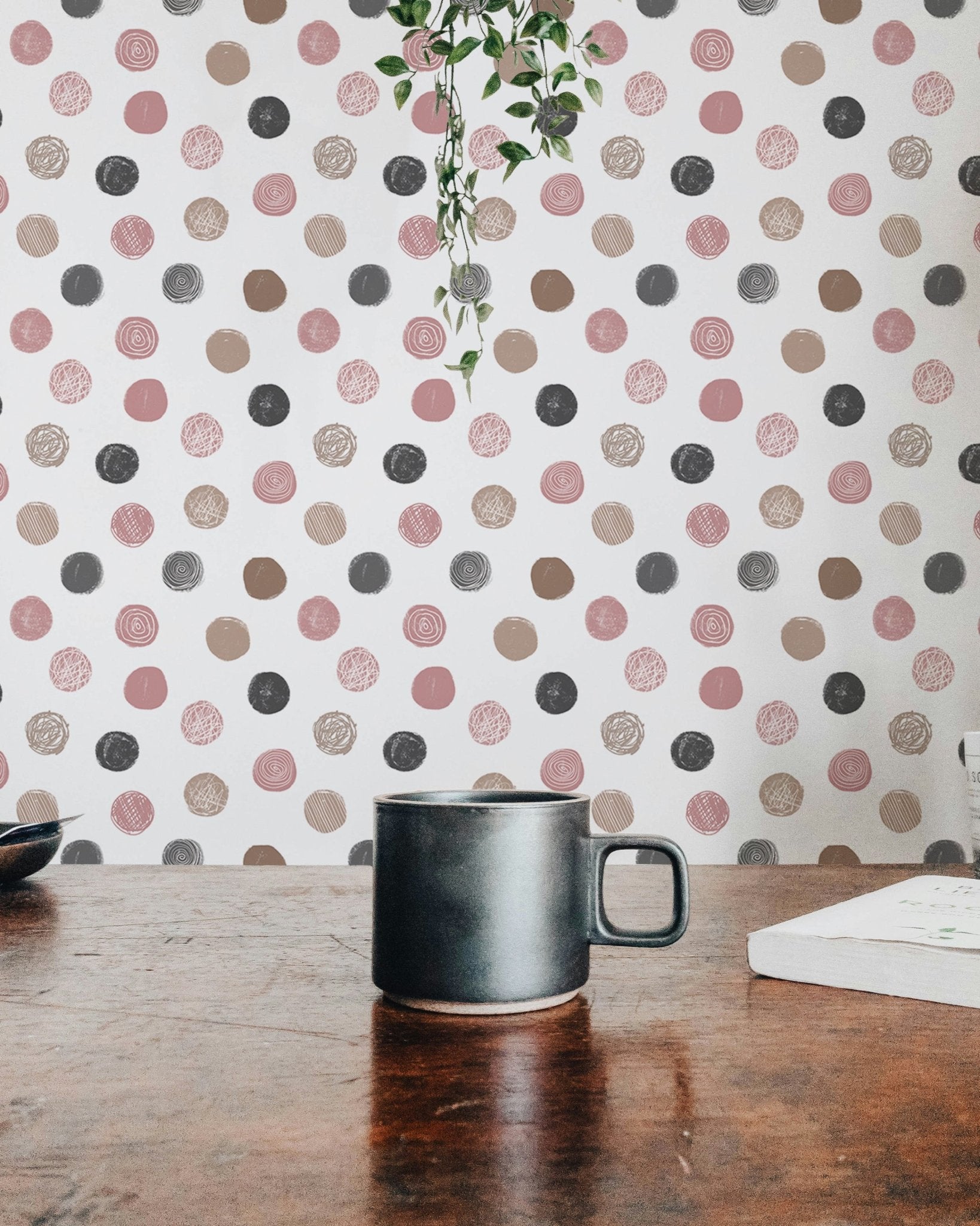 Coffee table view with a patterned wallpaper in the background.