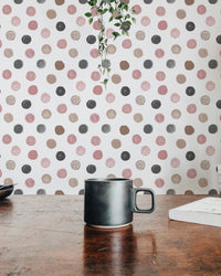 Coffee table view with a patterned wallpaper in the background.