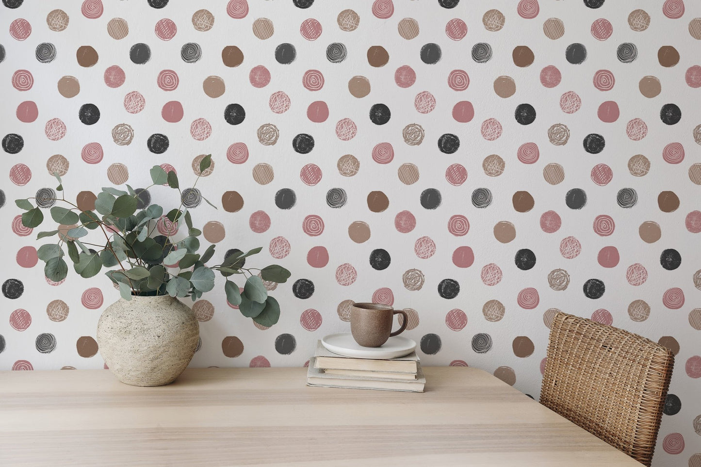 Minimalist dining room with a white sofa and circular pattern wallpaper.