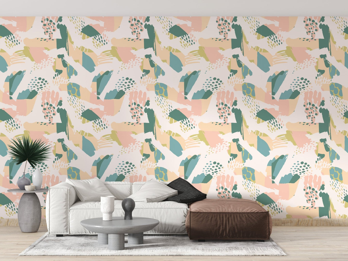 Pastel wallpaper in a minimalist living space with a grey ottoman.