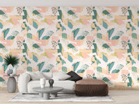 Pastel wallpaper in a minimalist living space with a grey ottoman.