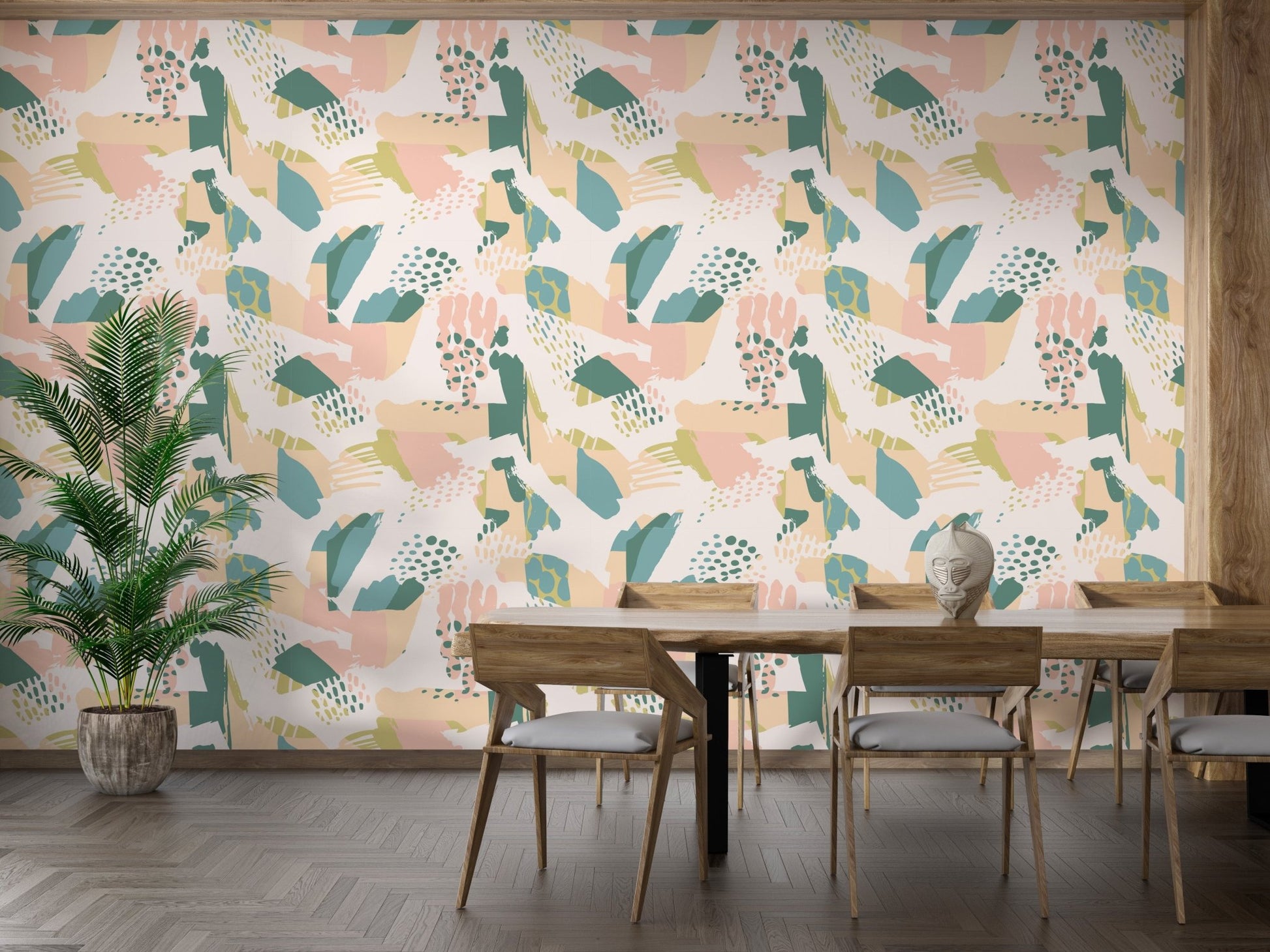 Floral and geometric pattern wallpaper behind a dining table and wooden chairs.