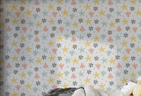 Pastel Starfish Wallpaper for kids bedroom in pink, yellow and blue.