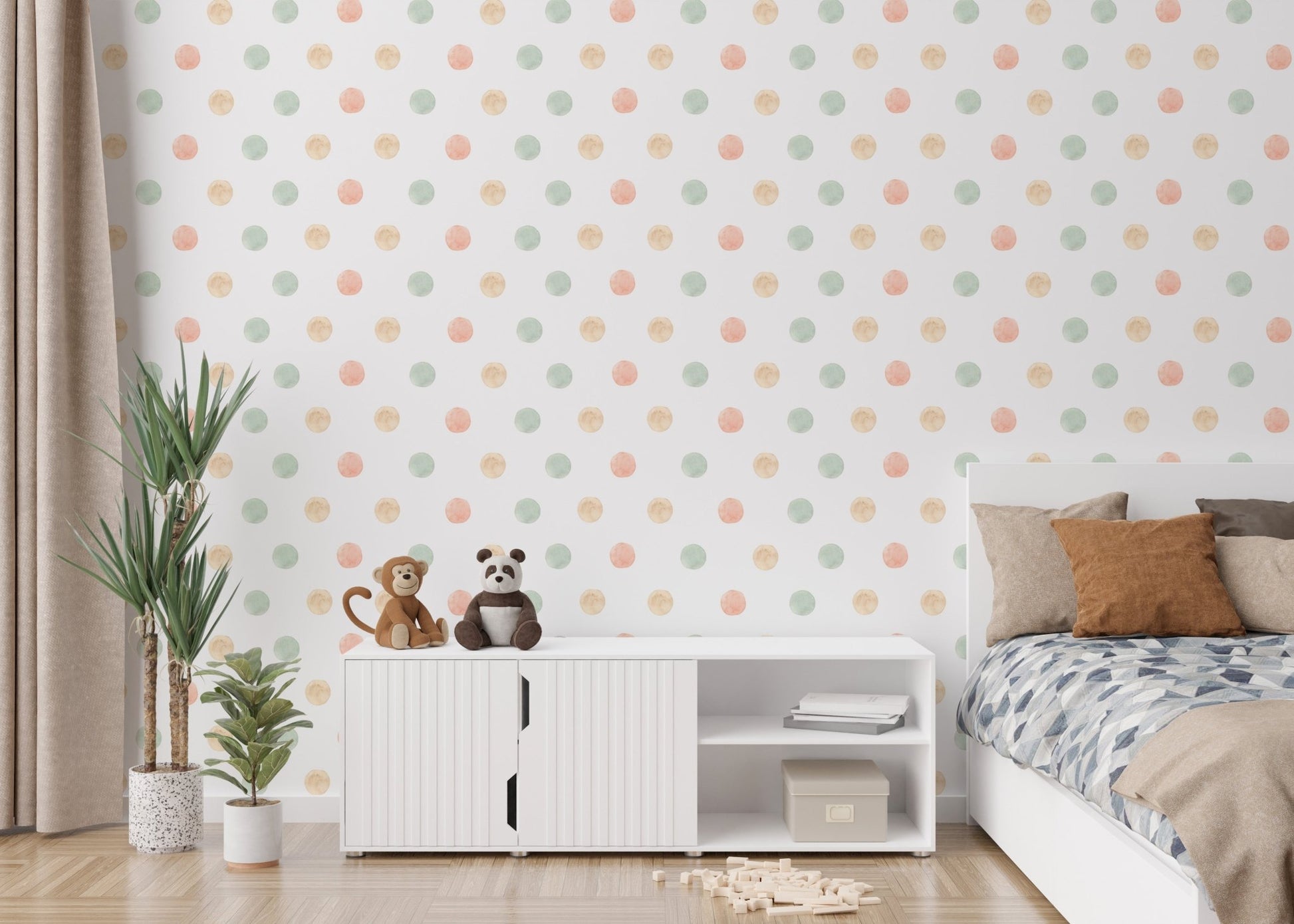 Kids bedroom with white storage unit and pastel watercolor polka dots wallpaper.