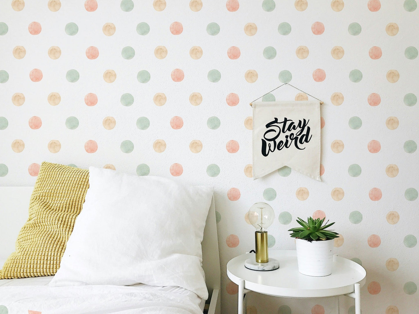 Bedroom feature wall using pastel watercolor polka dots isolated white wallpaper.