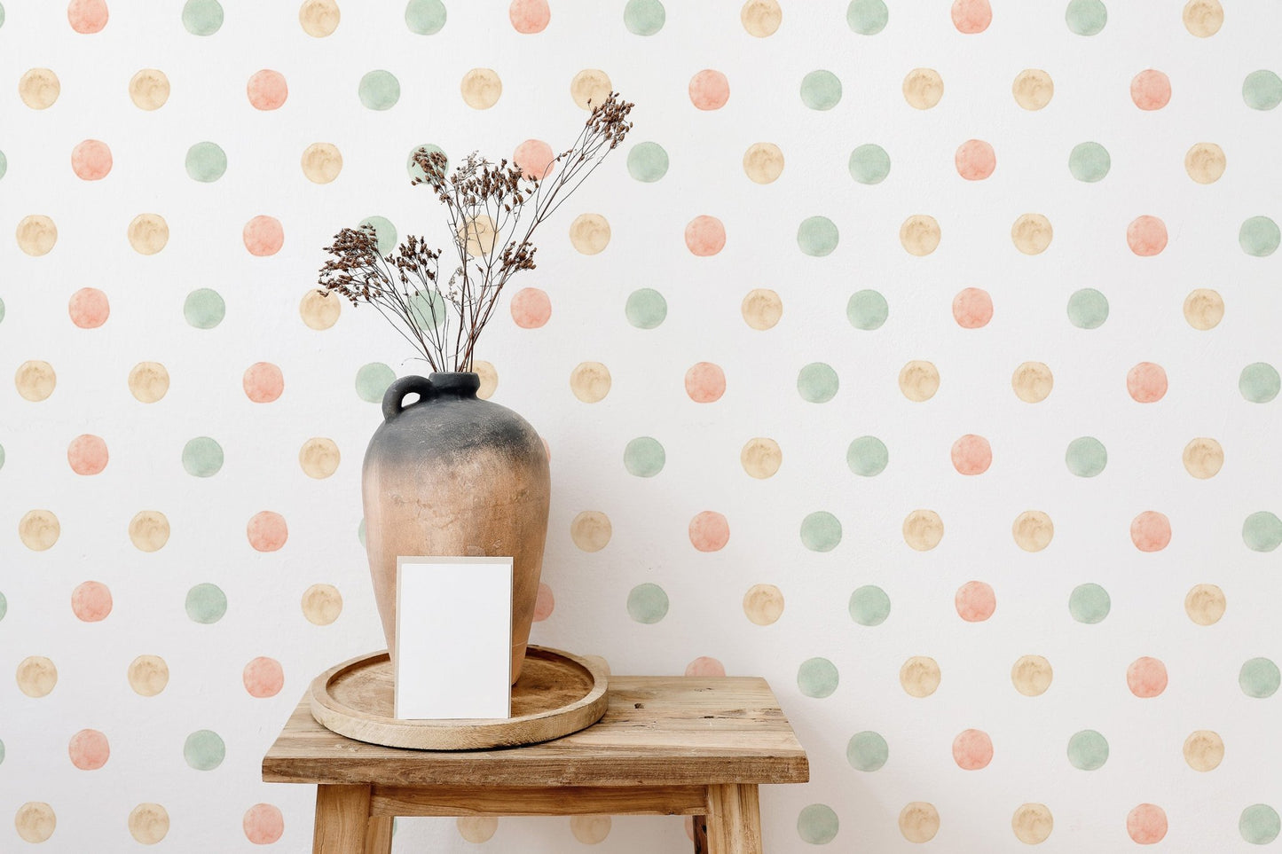 Minimalist decor with pastel watercolor polka dots isolated white wallpaper and dried flowers.