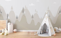 Grey and beige mountain landscape wall mural with a white play teepee.