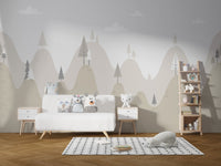 Alpine mountain wall mural in a nursery with a wooden pram and white table.