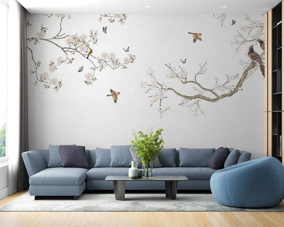 Delicate blossom branch wall mural wallpaper in neutral pastel tones.