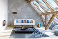 White flower field wall mural in an attic living with wooden beams and a white sofa.