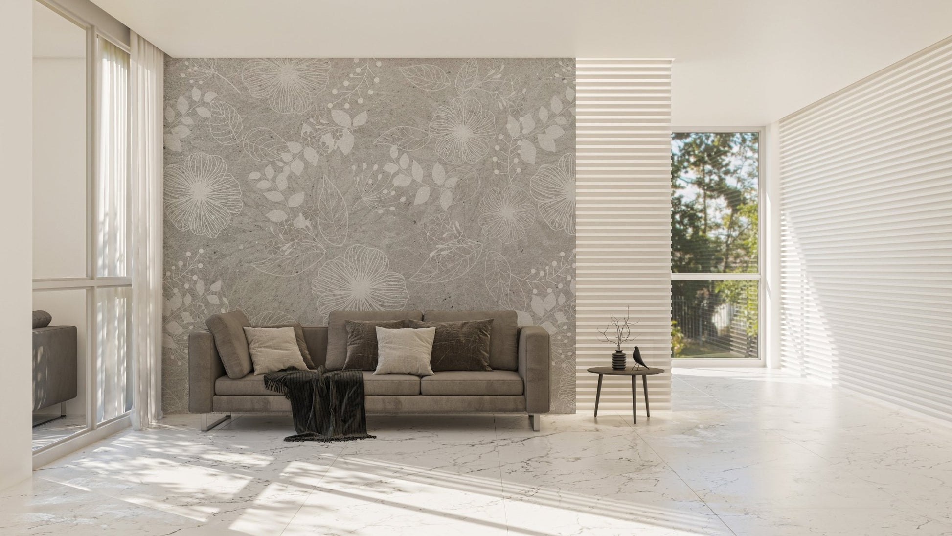 Grey flower wall mural behind a brown leather sofa in a bright living room.