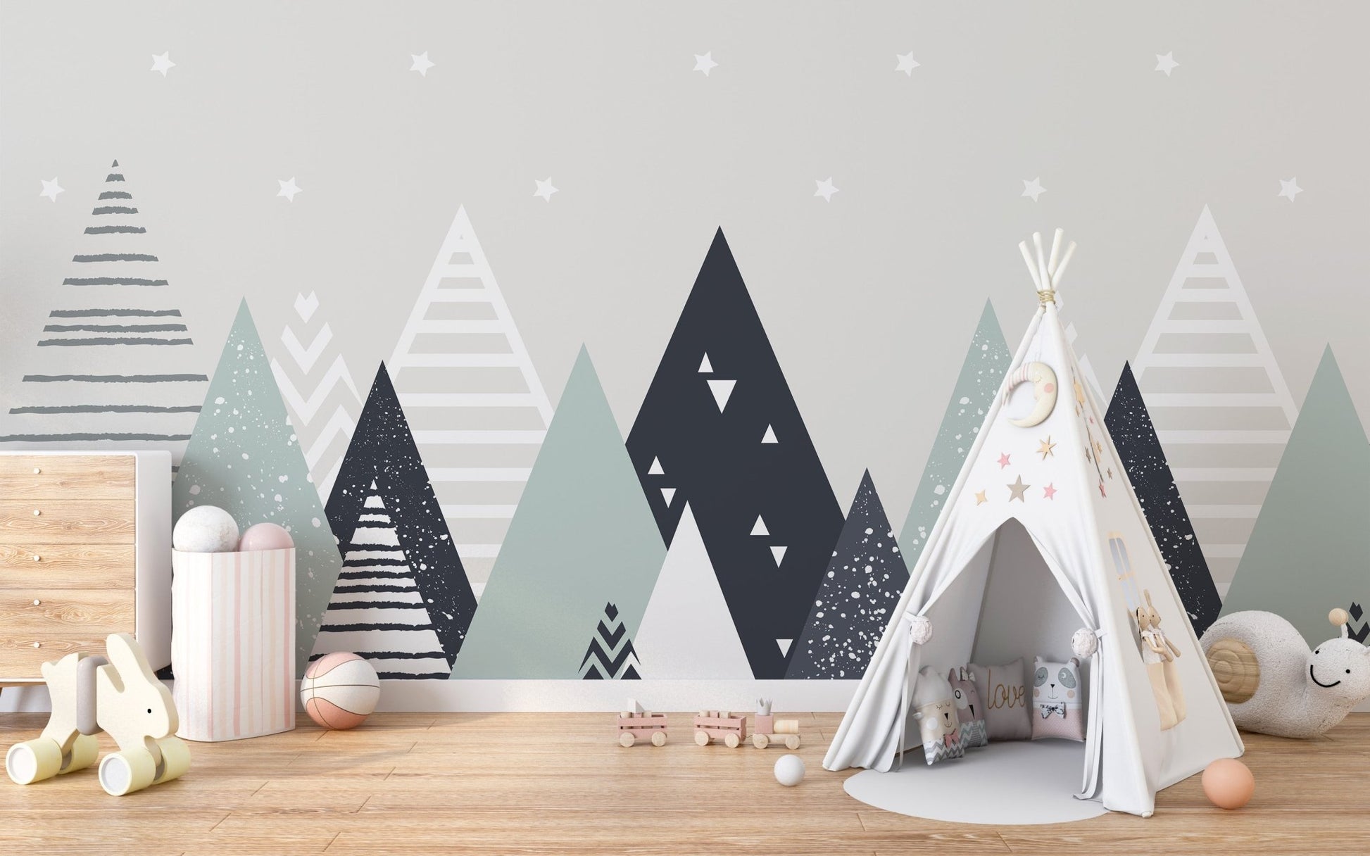 Grey and white triangle patterns wall mural behind a canvas play teepee.
