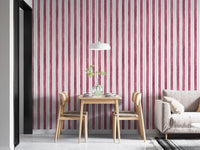 Pink and white striped wallpaper in a modern dining space with a grey rug.