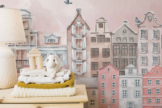 Watercolor city skyline wall mural in blush pink color.