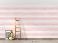 Pink watercolor effect wallpaper in a room with a ladder and storage.