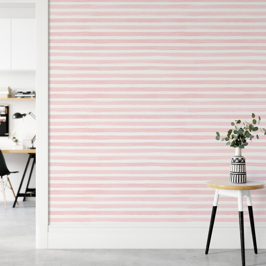 Pink Color Abstract Stripe Watercolor Wallpaper in a room with a white stool.