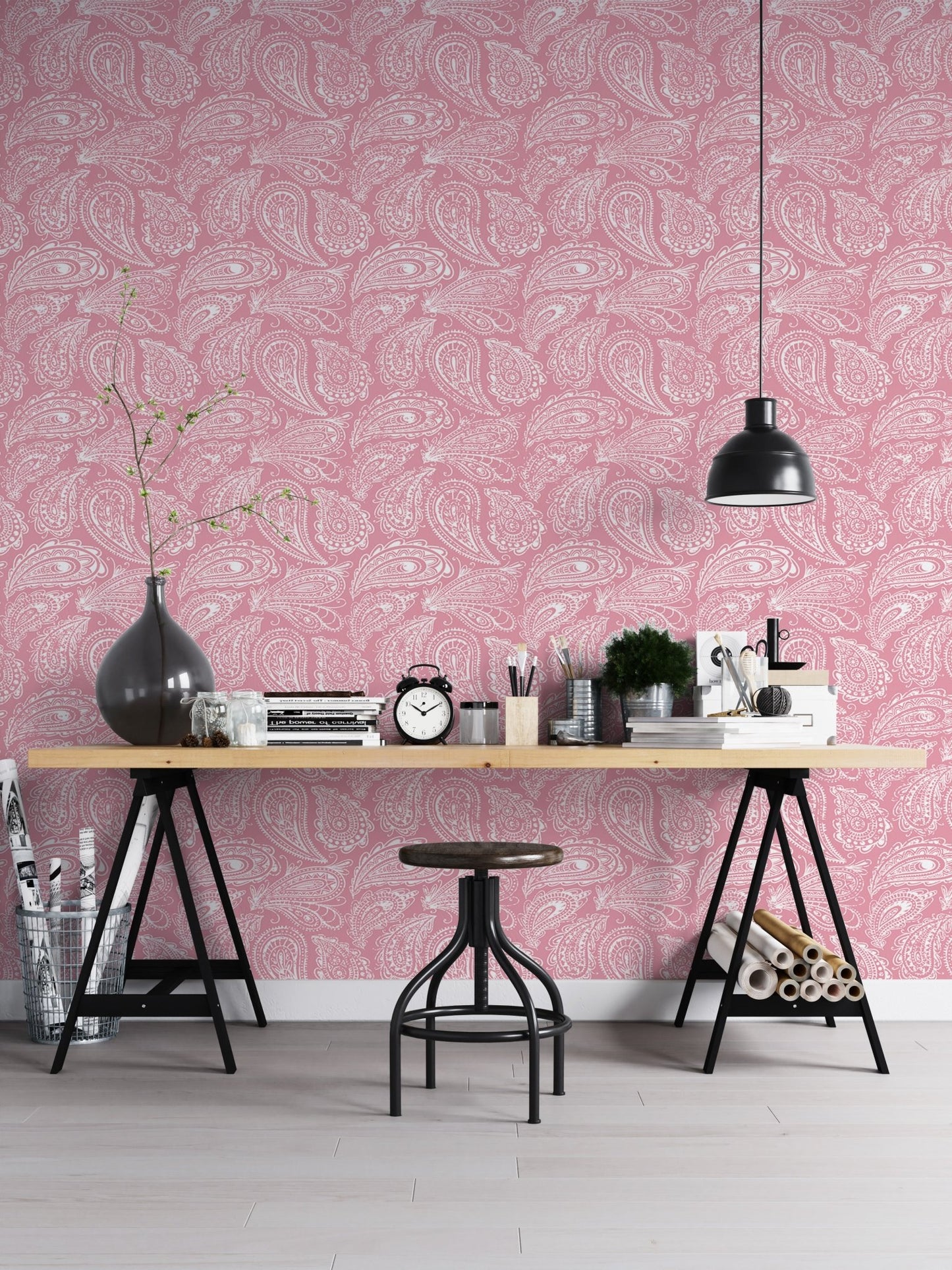 Home office setup with pink ornament wallpaper and a black metal desk.