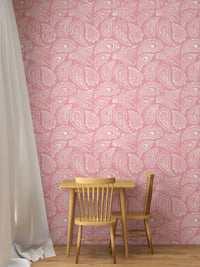Kids dining area featuring pink paisley wallpaper and a small wood table set.