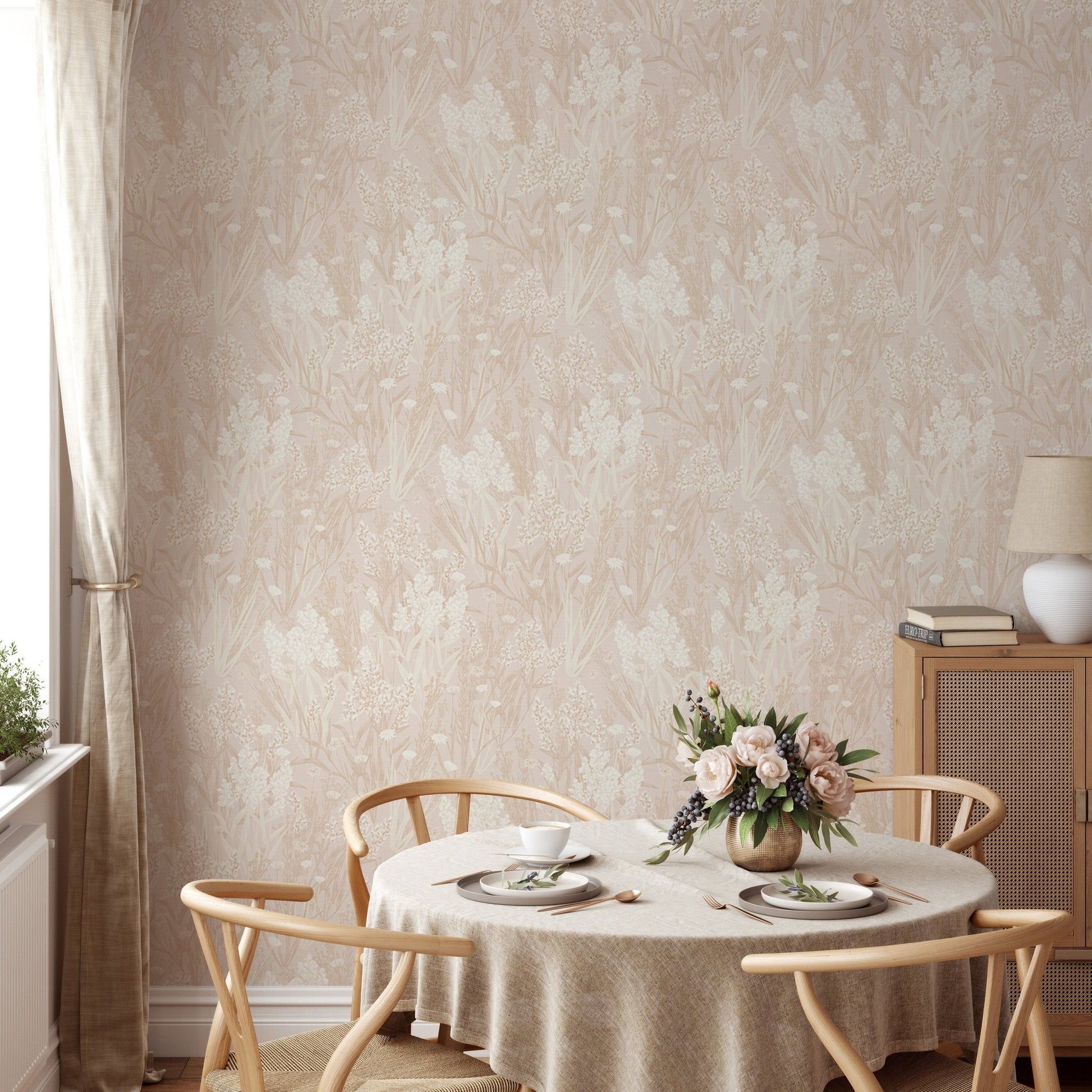 Botanical pattern wallpaper in a dining space with a round table