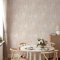 Botanical pattern wallpaper in a dining space with a round table