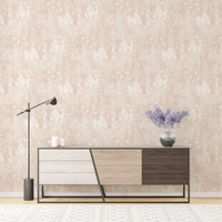 Botanical leaf pattern wallpaper behind a modern sideboard and lamp