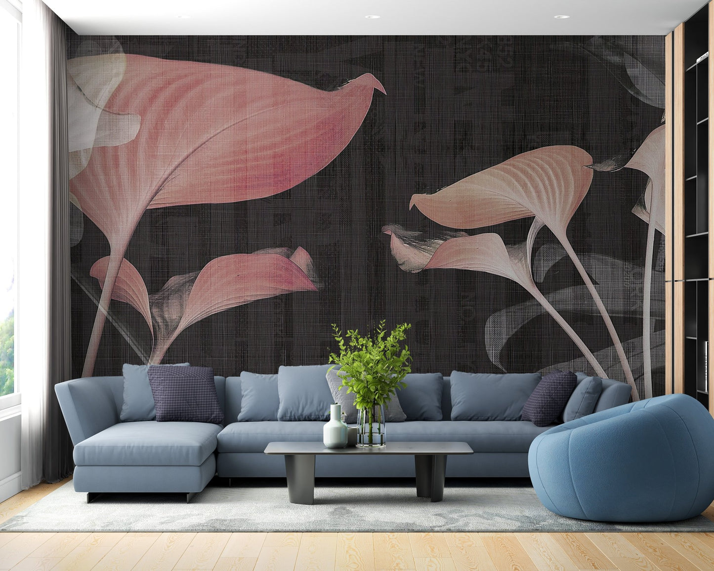 Blue sectional sofa in living room paired with soft pink floral wall mural.