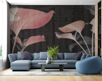 Blue sectional sofa in living room paired with soft pink floral wall mural.