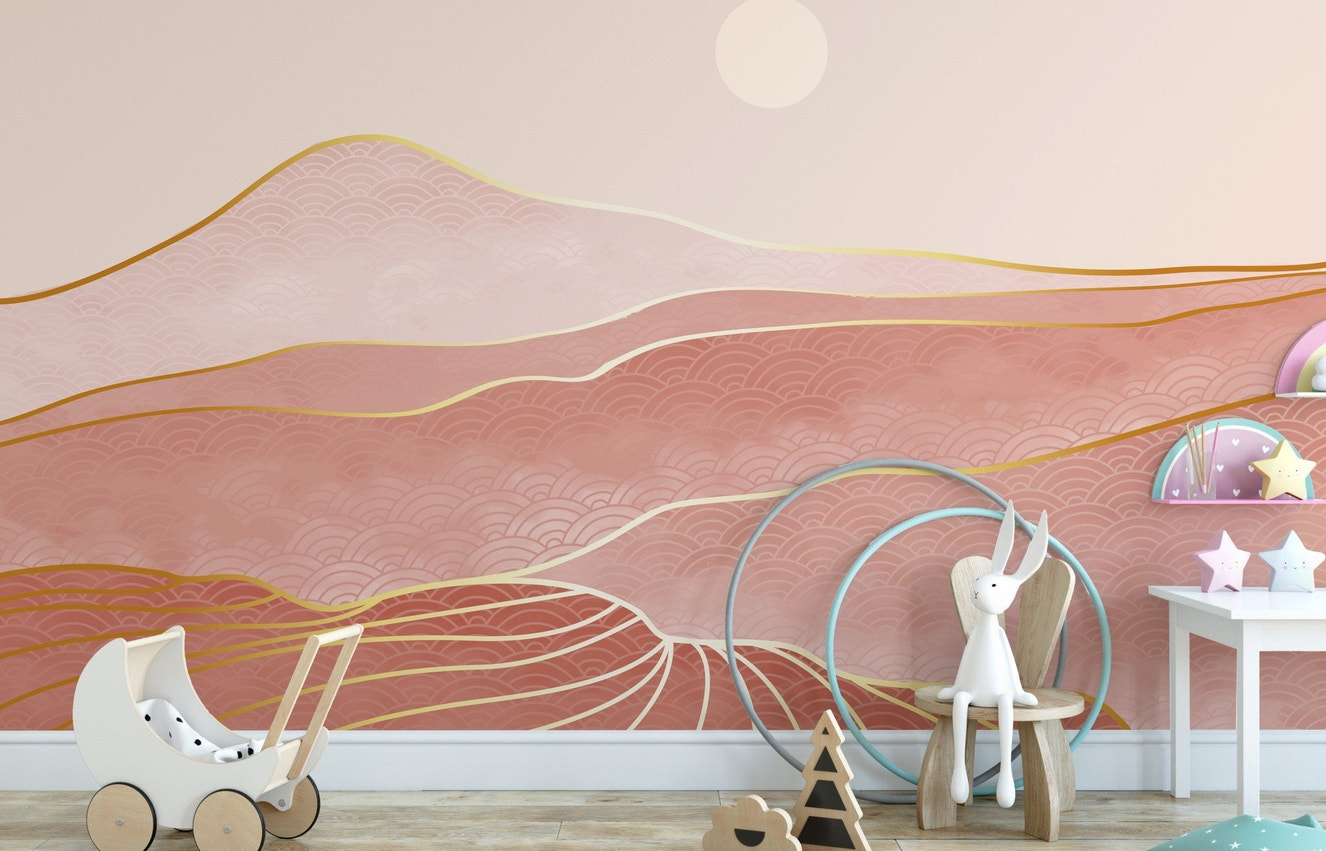 Nursery wall mural with pink abstract hills and golden lines.