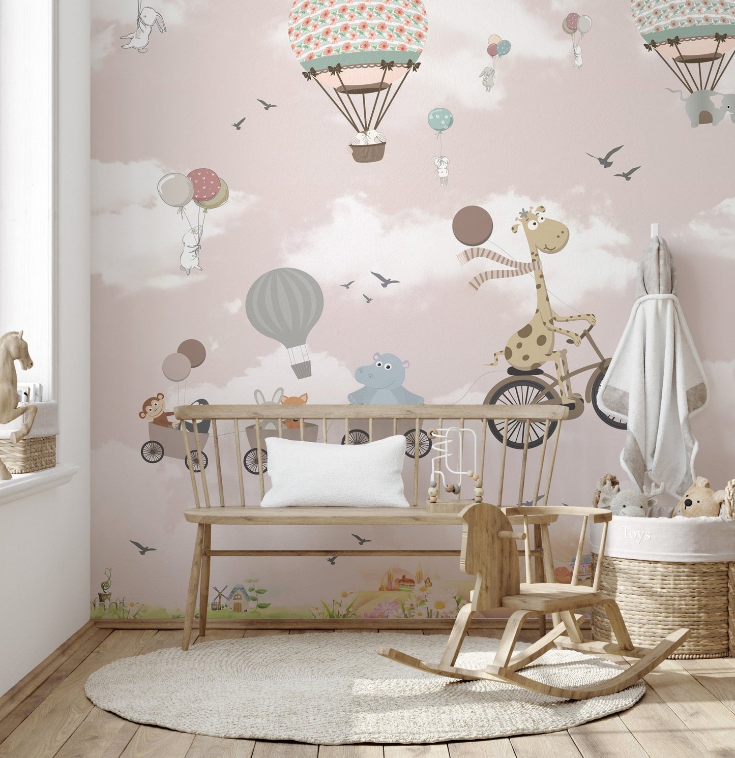 Cartoon animal wall mural with a rocking horse and wooden bench in a bright space.