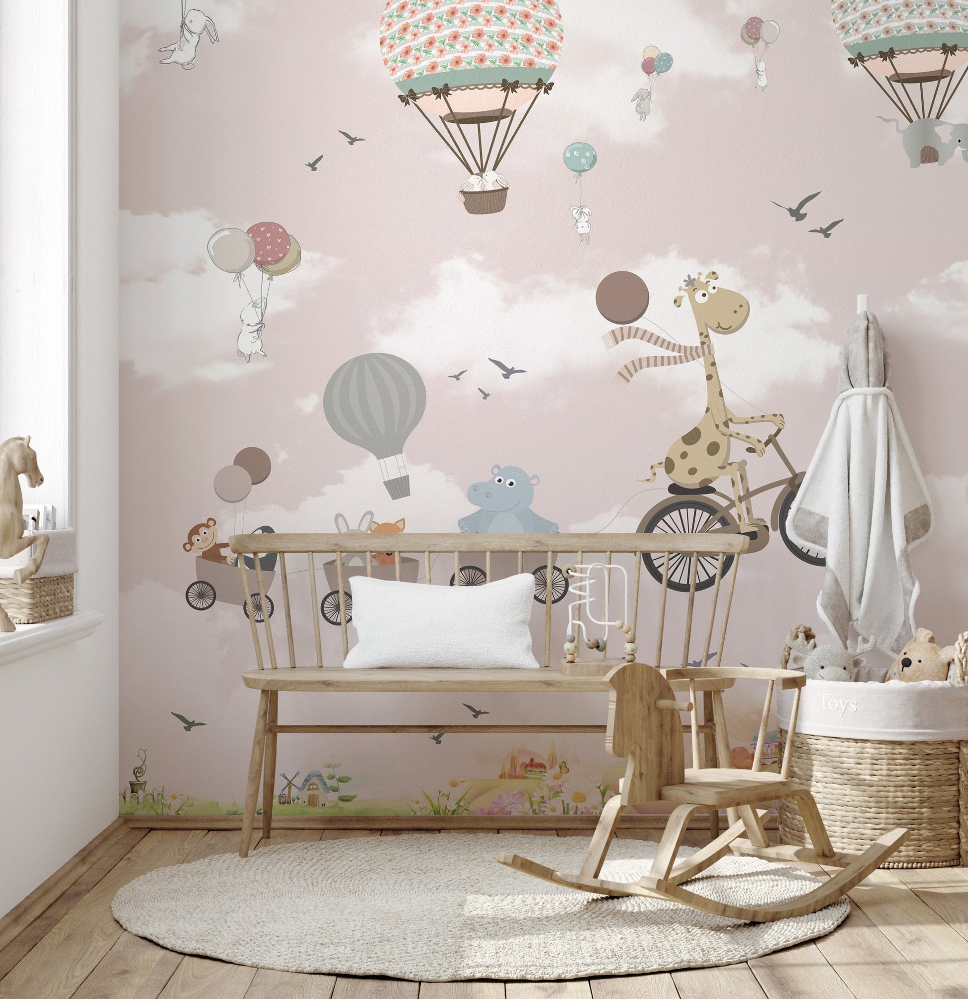 Cartoon animal wall mural with a rocking horse and wooden bench in a bright space.