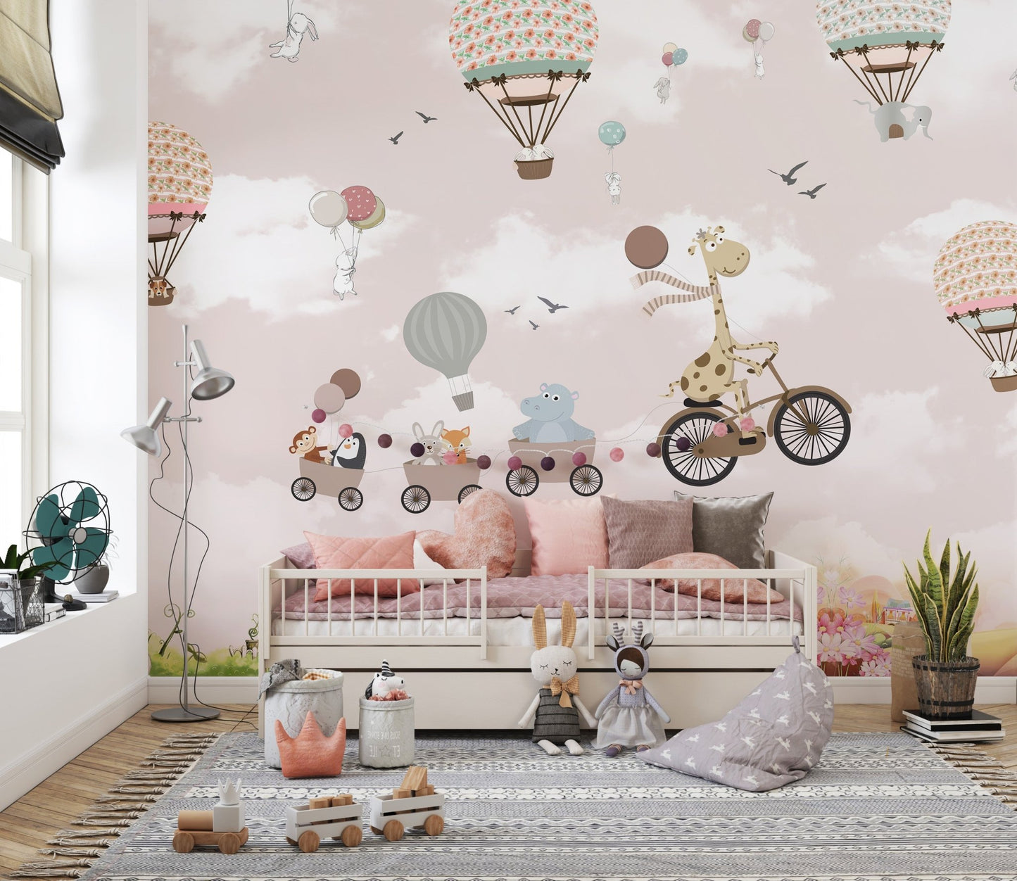 Pink Hot Air Balloon Animals Bicycle Wall Mural in a room with a grey rug and toys.