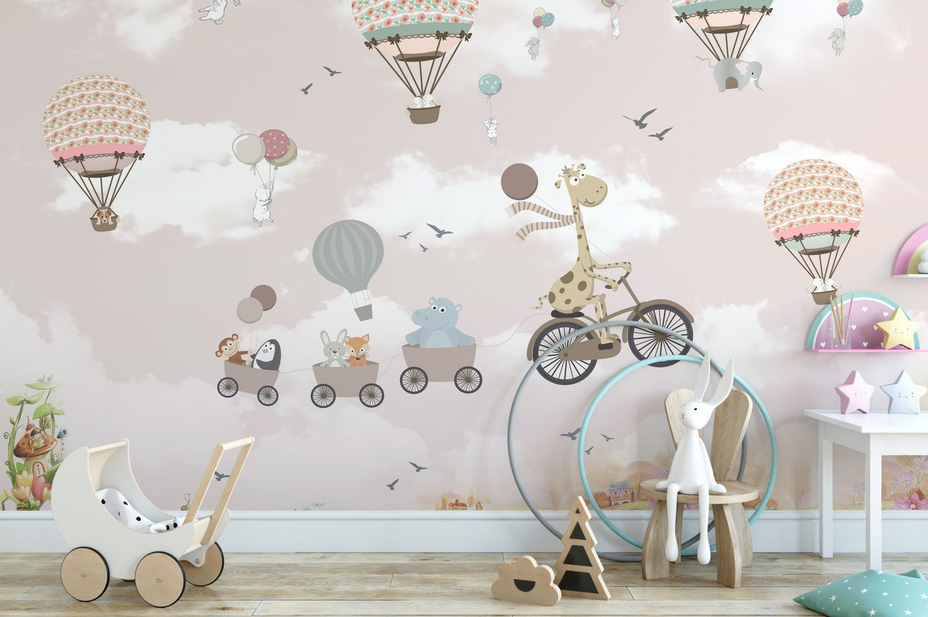 Pink Hot Air Balloon Animals Bicycle Wall Mural in a play area with a toy stroller.