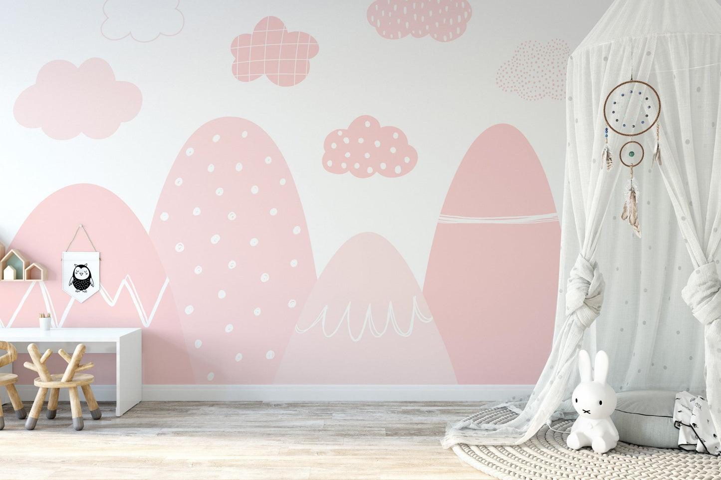 Elegant pink mountain mural with a misty, ethereal design in nursery.
