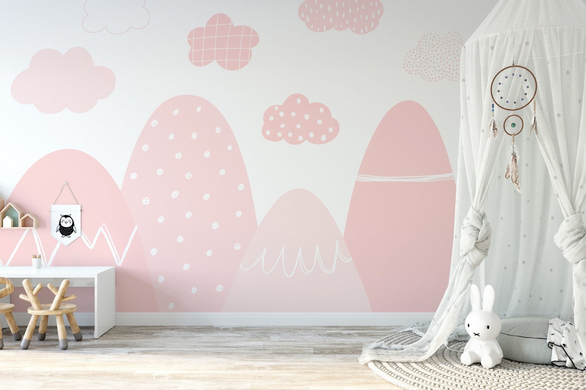 Elegant pink mountain mural with a misty, ethereal design in nursery.
