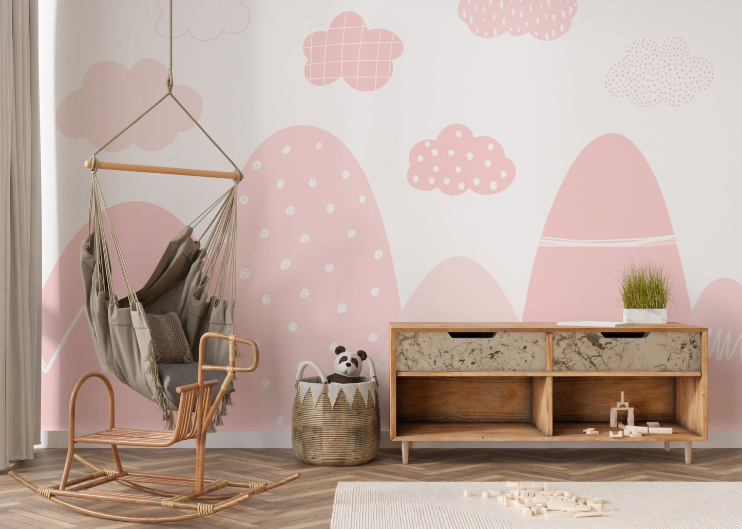 Tranquil pink mountain mural with misty, scenic details in nursery.
