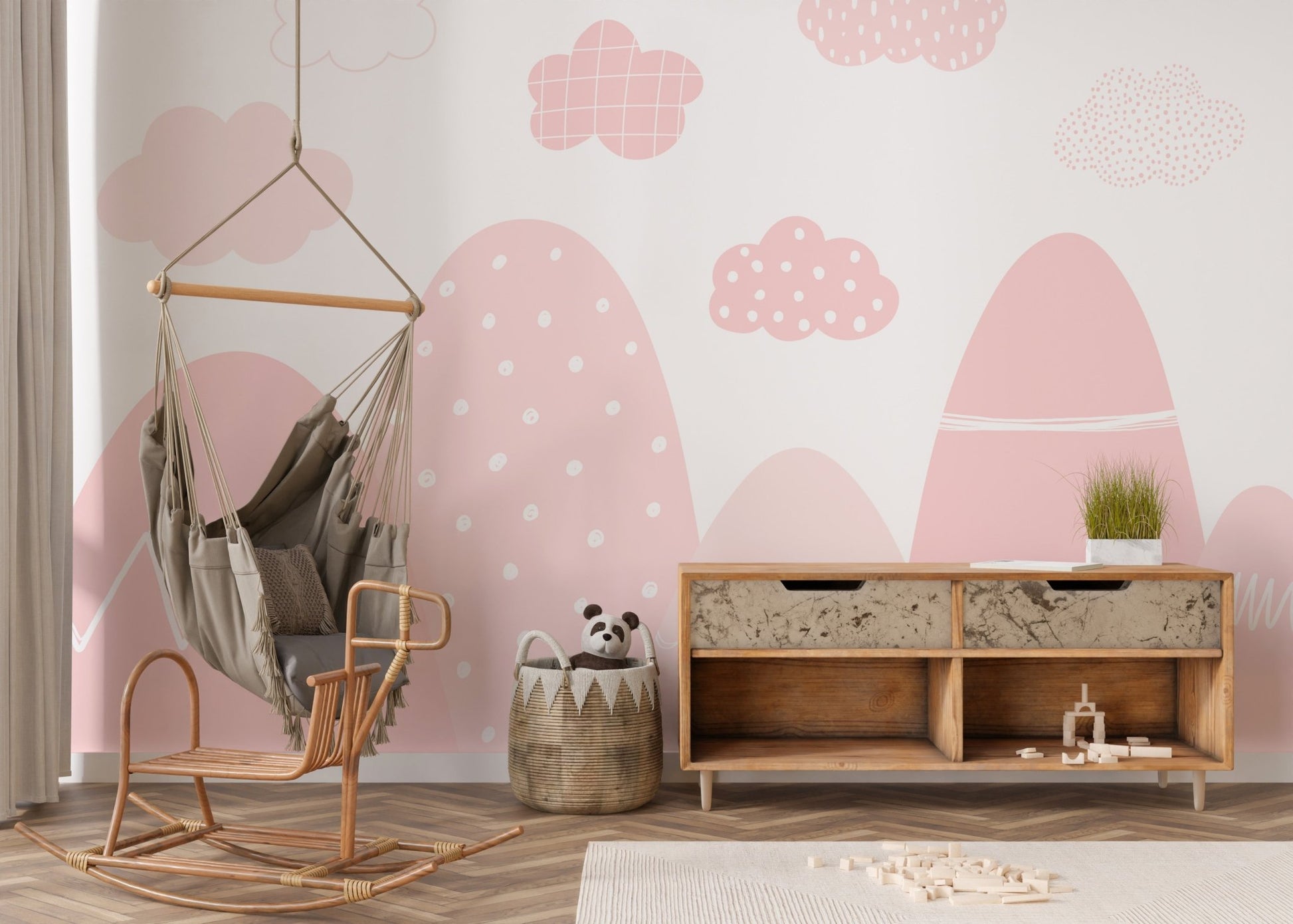 Tranquil pink mountain mural with misty, scenic details in nursery.
