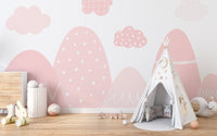 Captivating pink mountain mural for artistic playroom wall.

