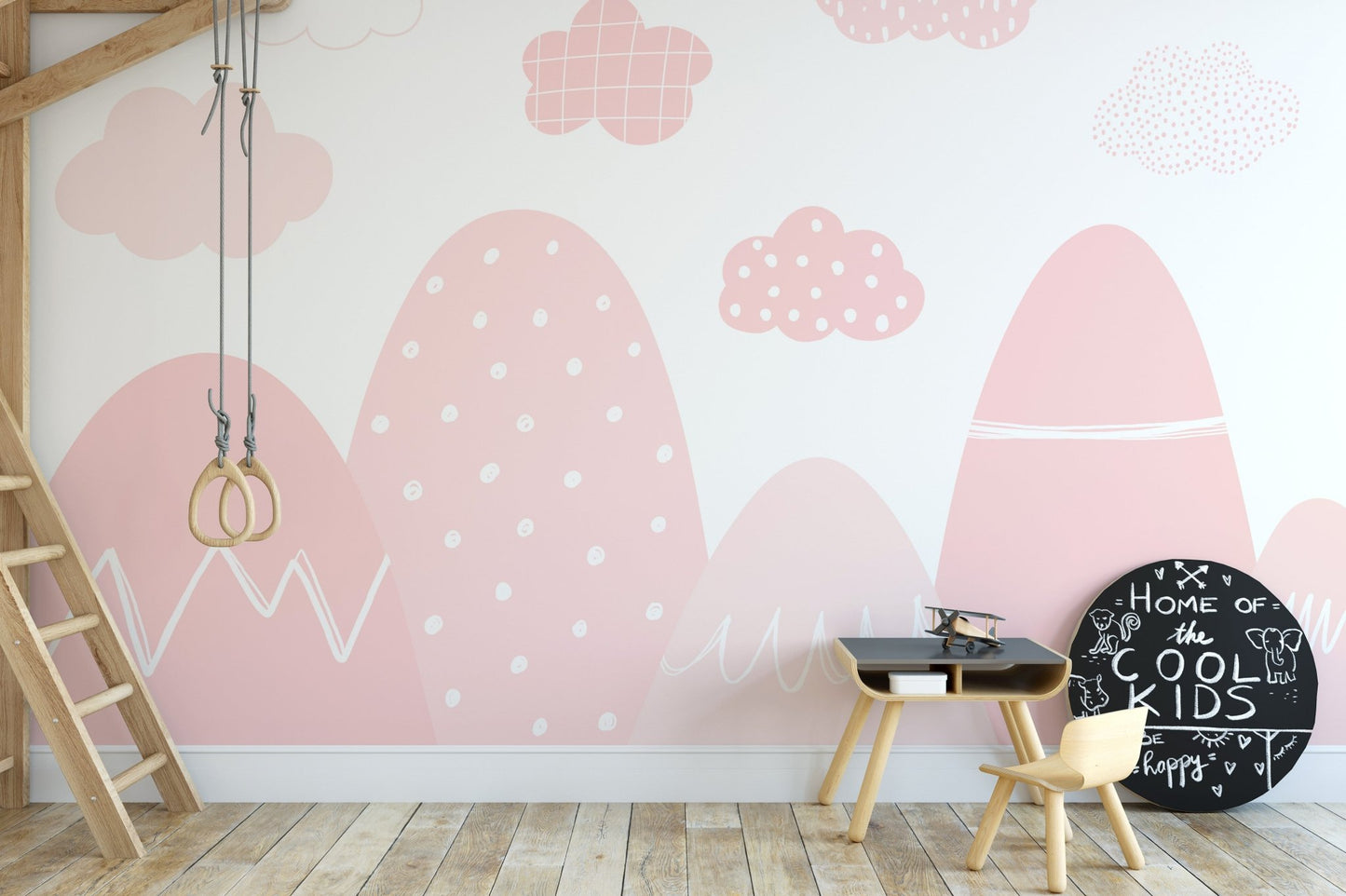Pink misty mountains wall mural creating a tranquil ambiance in kids area.
