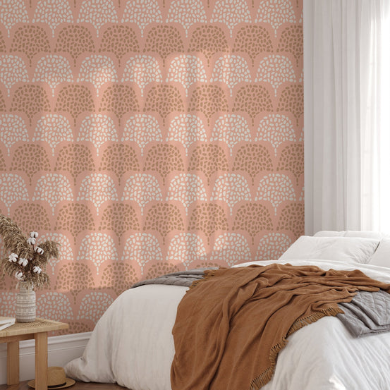 Terracotta pink wallpaper for bedroom walls with a bohemian repeat print.